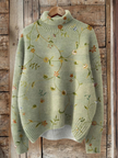 Cora — Camisola de gola subida com padrão floral