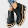 Samira – Botins de cunha com acabamento luminoso